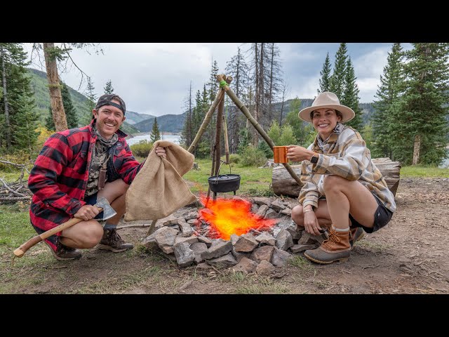 Couple cooking at campsite