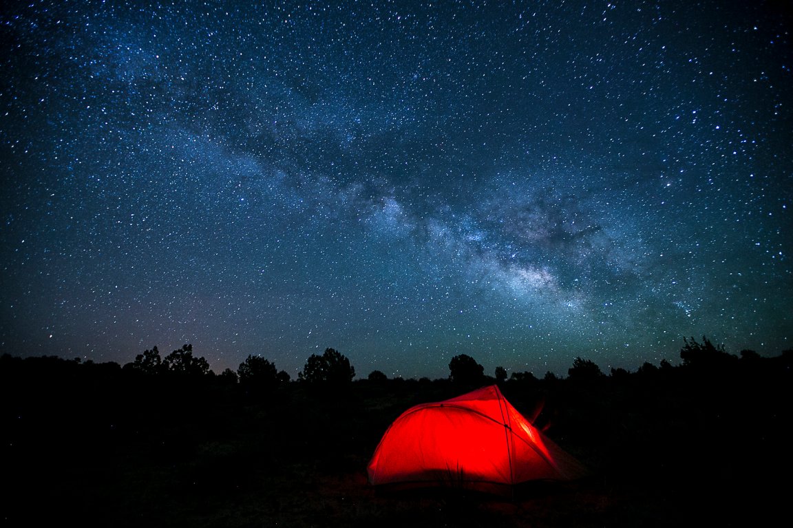 Camping tent under starry night